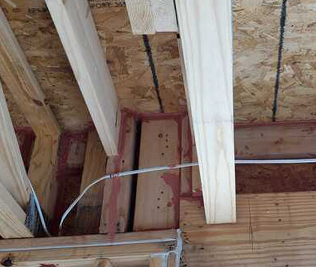 Energy star air seal with fire rated foam and red fire caulk.