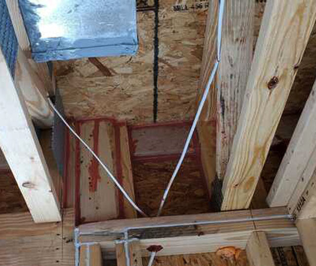 Energy star air seal with fire rated foam and red fire caulk.