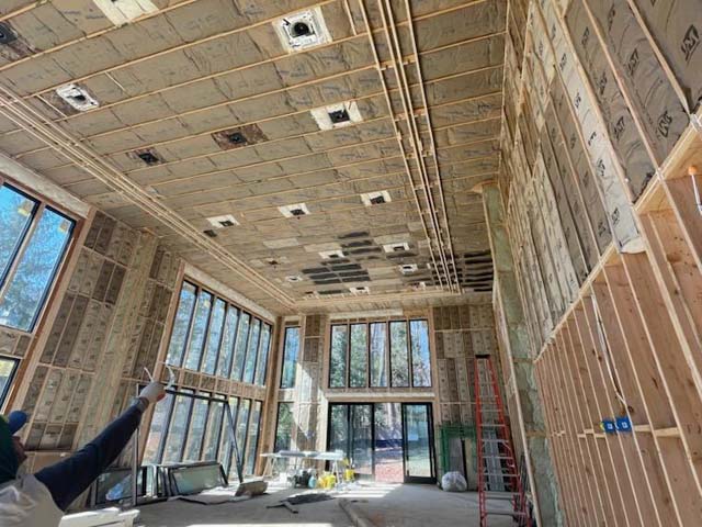 Fiberglass batt insulation installed in ceiling.