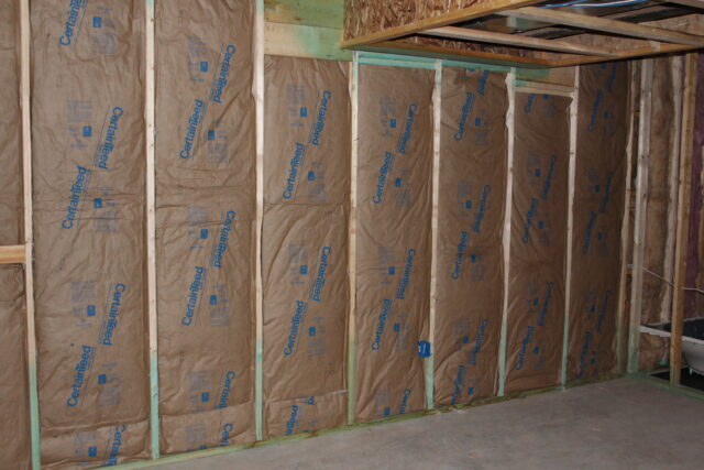 Installed fiberglass insulation