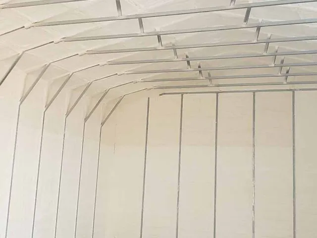Completed spray foam insulation in metal building.