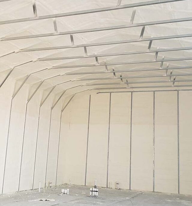 Southland Insulators closed cell spray foam insulation applied to metal building interior roof and walls in Virginia.