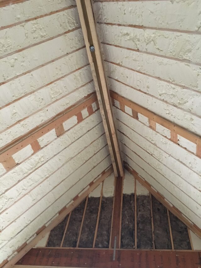 Spray foam insulation in the ceiling of a peaked attic.
