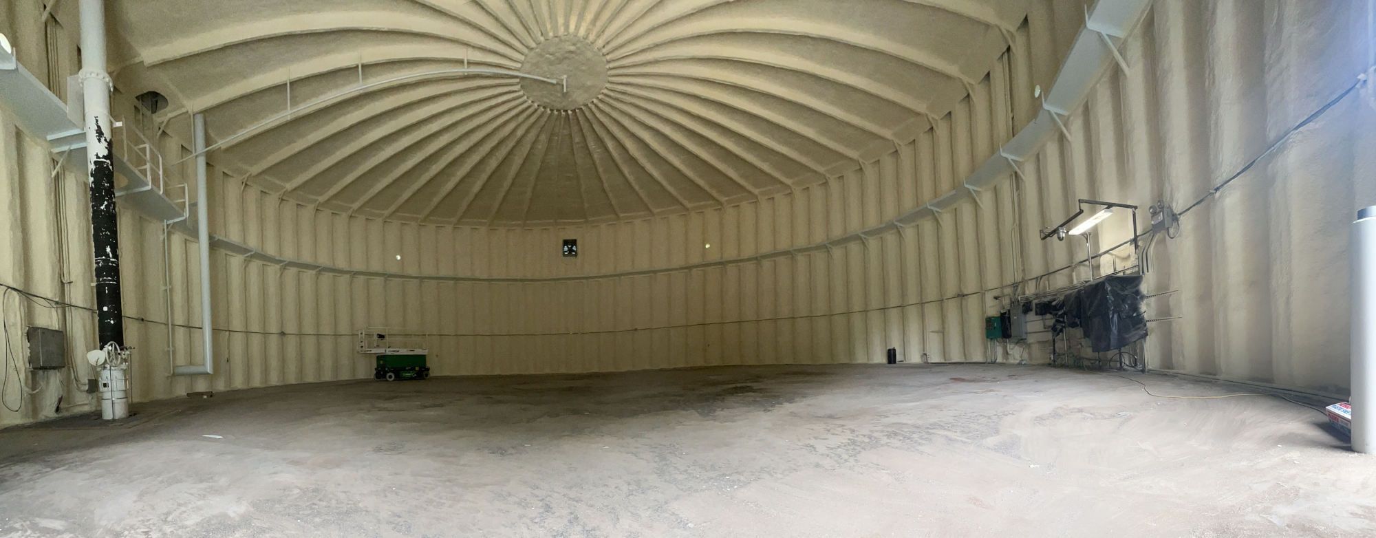 Spray Foam insulation on the interior of a large water storage tank.