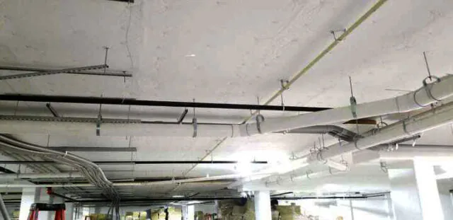 White facing versa board at parking garage ceiling