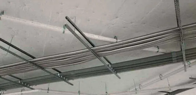 White facing versa board at parking garage ceiling